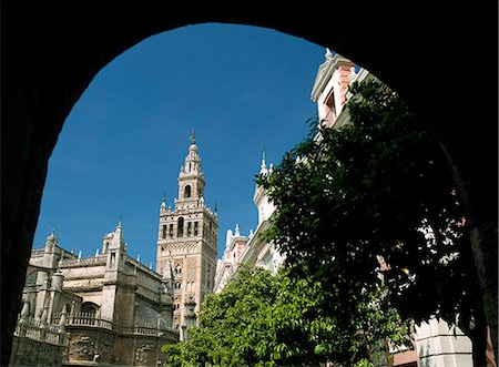 seville spain cathedral - Giralda Tower through archway,Seville,Andalucia,Spain Stock Photo - Rights-Managed, Code: 851-02962942