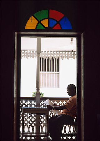 Man reading newspaper,Stone Town,Zanzibar,Tanzania Stock Photo - Rights-Managed, Code: 851-02963347