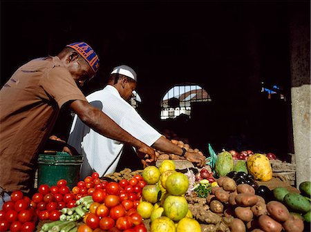 Fruitsellers laying out fruit,Stone Town,Zanzibar Island. Tanzania Stock Photo - Rights-Managed, Code: 851-02963351