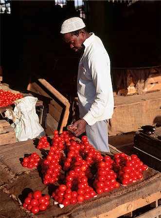 Man in market with tomatoes,Stone Town,Zanzibar Island. Tanzania Stock Photo - Rights-Managed, Code: 851-02963352