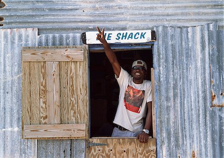 póster - Man in the door of the local 'Shack',Salt Cay,Turks and Caicos Islands Foto de stock - Con derechos protegidos, Código: 851-02963369