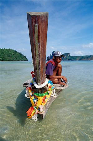 simsearch:851-02960274,k - Long-boat and boatman,Ko Phi Don island,Thailand Stock Photo - Rights-Managed, Code: 851-02963445