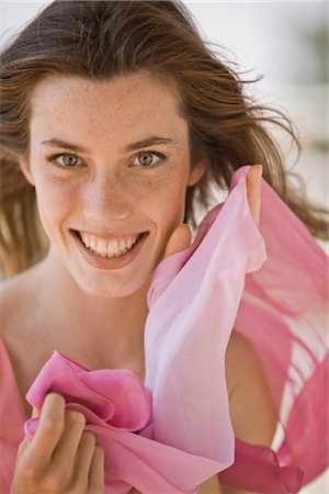 pink cloth - Smiling young woman with long brown hair Stock Photo - Rights-Managed, Code: 853-05523395
