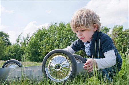 Blond boy playing outside Stock Photo - Rights-Managed, Code: 853-05523489