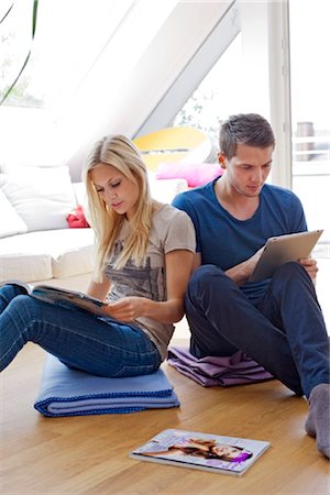 people reading magazines and tablets - Young couple with ipad Stock Photo - Rights-Managed, Code: 853-05523614