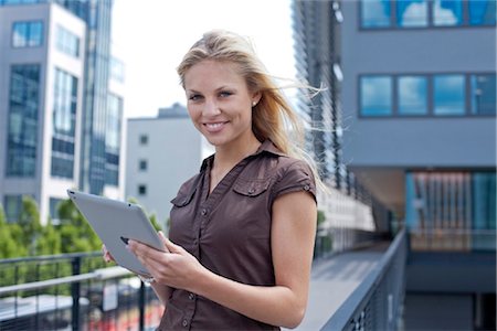 exterior (outer side or surface of something) - Young woman with ipad Stock Photo - Rights-Managed, Code: 853-05523622