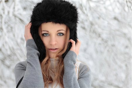 Young woman with cap in snow Stock Photo - Rights-Managed, Code: 853-05523678