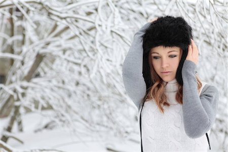 Young woman with cap in snow Stock Photo - Rights-Managed, Code: 853-05523684