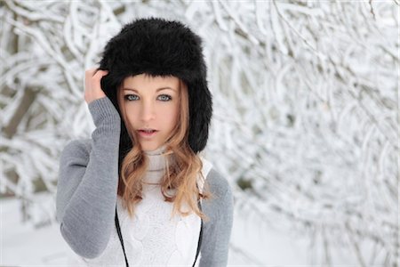 Young woman with cap in snow Stock Photo - Rights-Managed, Code: 853-05523682