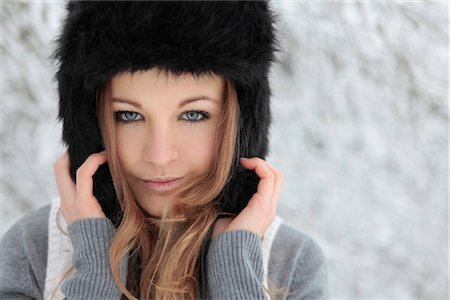 Young woman with cap in snow Stock Photo - Rights-Managed, Code: 853-05523683