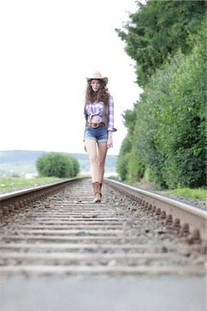 Jeune femme comme cow-girl Photographie de stock - Rights-Managed, Code: 853-05523743