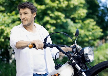 simsearch:853-03459121,k - Man with motorbike Stock Photo - Rights-Managed, Code: 853-05840892