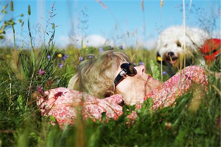 simsearch:853-07148552,k - Woman with dog lying on meadow, Black Forest, Baden-Wuerttemberg, Germany, Europe Stock Photo - Rights-Managed, Code: 853-05840952