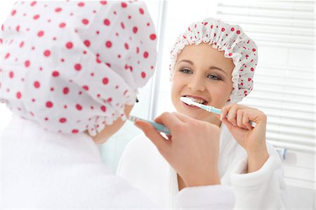 Young woman brushing teeth Stock Photo - Rights-Managed, Code: 853-06120579