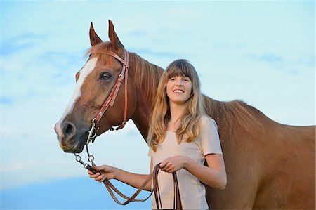 people nature concept - Smiling teenage girl with horse Stock Photo - Rights-Managed, Code: 853-06306111