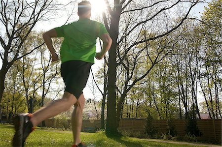 simsearch:853-06441607,k - Man running over meadow Stock Photo - Rights-Managed, Code: 853-06441359