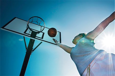 Young woman playing basketball Stock Photo - Rights-Managed, Code: 853-06441494