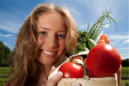 simsearch:853-06441524,k - Young woman with vegetables in basket Stock Photo - Rights-Managed, Code: 853-06441530