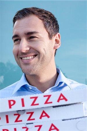 simsearch:853-06441607,k - Man with pizza boxes Stock Photo - Rights-Managed, Code: 853-06441565