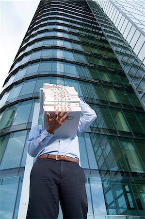 pizza on black - Man with pizza boxes in front of his face Stock Photo - Rights-Managed, Code: 853-06441568