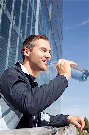 drinking water bottle - Man jogging Stock Photo - Rights-Managed, Code: 853-06441593