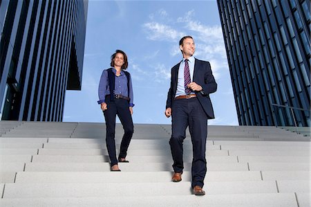 simsearch:853-06441666,k - Businessman and businesswoman walking on stairs Stock Photo - Rights-Managed, Code: 853-06441702