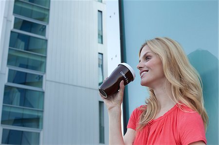 paper cup - Blond woman drinking coffee to go Stock Photo - Rights-Managed, Code: 853-06441759