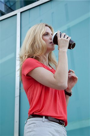 Blond woman drinking coffee to go Stock Photo - Rights-Managed, Code: 853-06441764