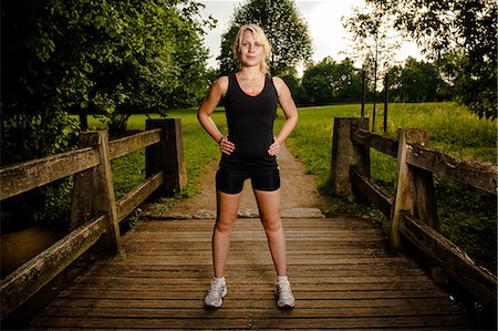 riscaldare - Young woman doing fitness training,Baden-Wuerttemberg, Germany Fotografie stock - Rights-Managed, Codice: 853-06442041