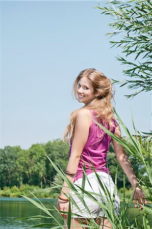 facing camera satisfaction - Blond young woman at a lake Stock Photo - Rights-Managed, Code: 853-06442054