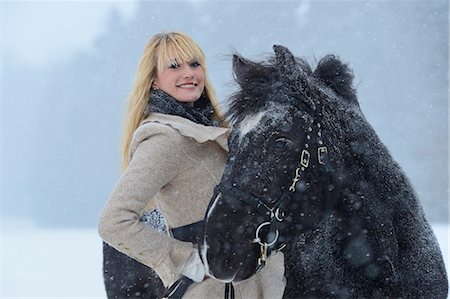 Young woman with horse in snow, Upper Palatinate, Germany, Europe Stock Photo - Rights-Managed, Code: 853-06623185