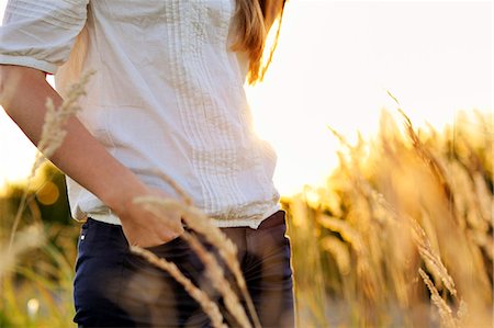 Young woman with hand in trouser pocket, Bavaria, Germany, Europe, mid section Photographie de stock - Rights-Managed, Code: 853-06623266