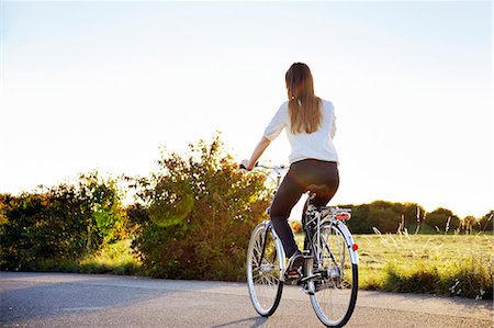 Young woman cycling, Bavaria, Germany, Europe Stock Photo - Rights-Managed, Code: 853-06623262