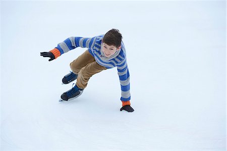 simsearch:853-07241922,k - Boy ice-skating on a frozen lake Stock Photo - Rights-Managed, Code: 853-06893172