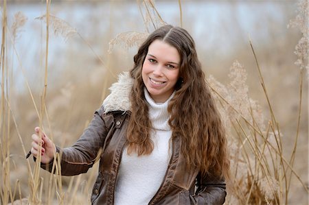 Smiling young woman outdoors, portrait Stock Photo - Rights-Managed, Code: 853-06893182