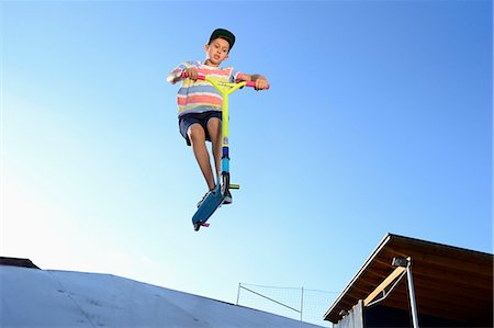 Boy with scooter in a skatepark Stock Photo - Rights-Managed, Code: 853-07148598