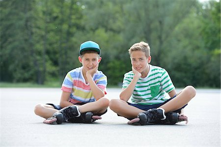 simsearch:853-07148615,k - Two boys with in-line skates on a sports place Stock Photo - Rights-Managed, Code: 853-07148593