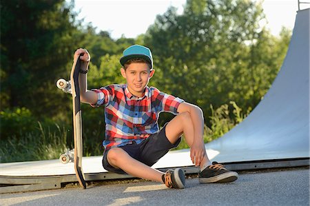 Boy with skateboard in a skatepark Stock Photo - Rights-Managed, Code: 853-07148606