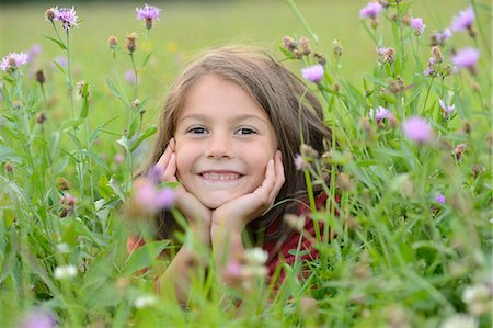 smile happy - Girl lying in a meadow Stock Photo - Rights-Managed, Code: 853-07241829