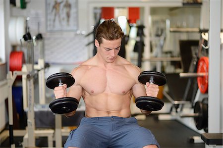 simsearch:853-07241922,k - Young man exercising in fitness center Stock Photo - Rights-Managed, Code: 853-07241929