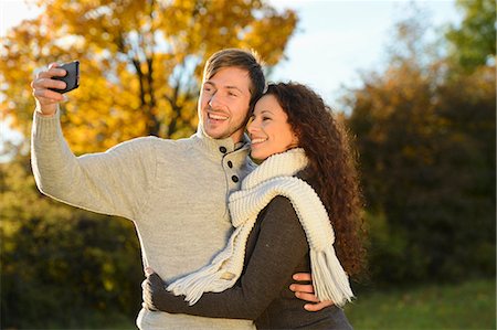 Happy couple in autumn taking a self portrait Photographie de stock - Rights-Managed, Code: 853-07241940
