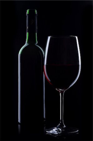 single glass of wine - bottle of wine and a glass of wine, dark background Stock Photo - Rights-Managed, Code: 853-02914093
