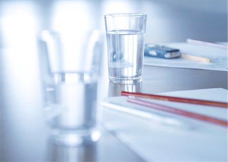 pencil and object - Two glasses of water, moblie phone and pens, cropped Stock Photo - Rights-Managed, Code: 853-02914139