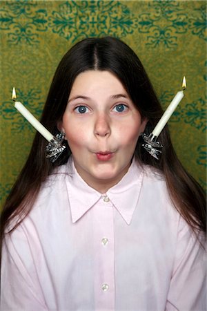 preteen girl surprise - Girl with two candle holders on her ears Stock Photo - Rights-Managed, Code: 853-02914206