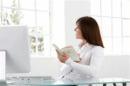 picture female under hair - Woman holding book, side view Stock Photo - Rights-Managed, Code: 853-02914270