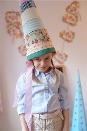 frolicking - Girl with cardboard cone Stock Photo - Rights-Managed, Code: 853-02914368