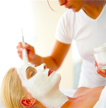 face pack - woman cleaning the face of another woman with a lotion Stock Photo - Rights-Managed, Code: 853-02914461