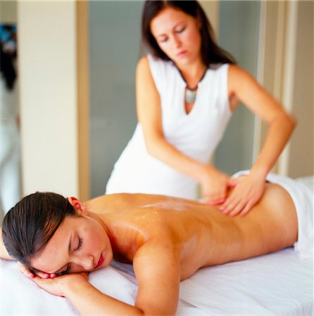 woman giving another woman a back massage Stock Photo - Rights-Managed, Code: 853-02914462