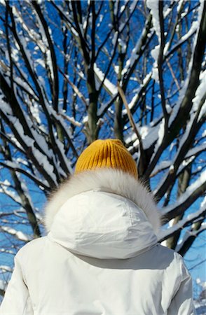 woman wearing a white, hooded jacket in winter, view from behind Stock Photo - Rights-Managed, Code: 853-02914598