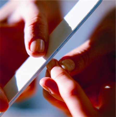 simsearch:853-02914720,k - hands of a woman filing her nails, close-up Stock Photo - Rights-Managed, Code: 853-02914619